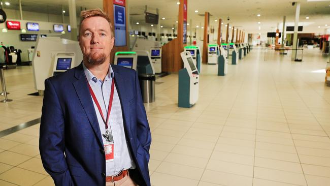 Queensland Aircorp Limited CEO Chris Mills in an empty Gold Coast Airport check-in area. Photo: Scott Powick.