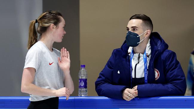 Mariah Bell speaks with her coach Adam Rippon.