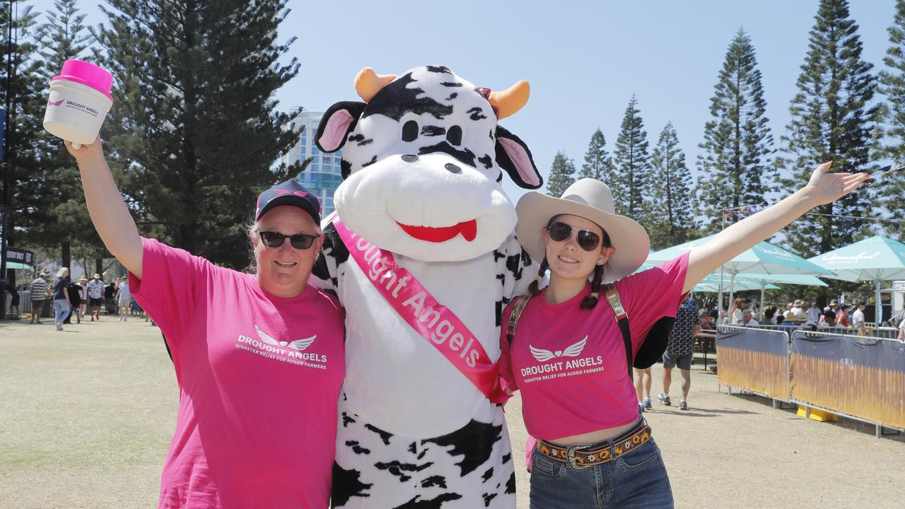 Tanya Littlewood, Tony Littlewood (Bessy the Drought Angles Cow) and Teanah Littlewood during the 10th Groundwater Country Music Festival. Picture: Regi Varghese