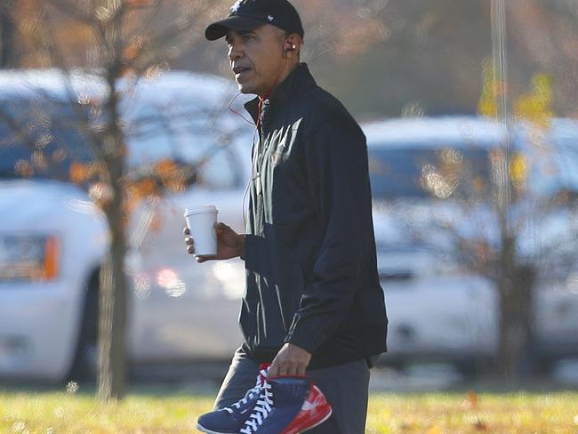 President Barack Obama plays basketball on election day at a military base. Picture: AP Photo/Pablo Martinez Monsivais.