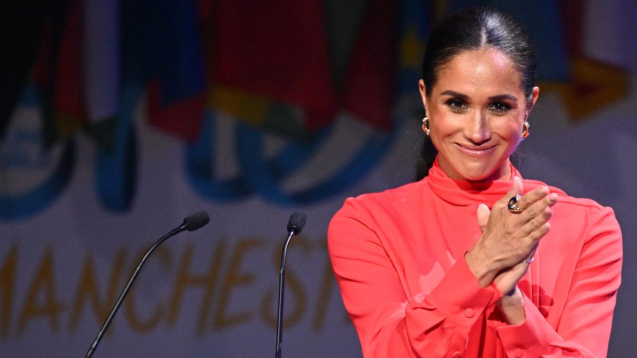 Meghan looking fab-u-lous in her second outfit of the day. Picture: Oli Scarff/AFP