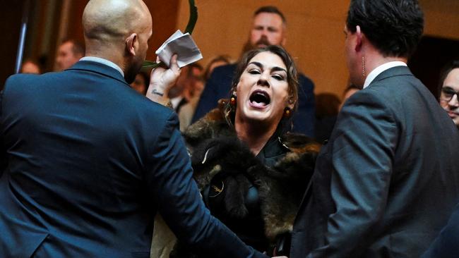 Australian Senator Lidia Thorpe stages a protest as Britain's King Charles and Queen Camilla attend a Parliamentary reception in Canberra, Australia - 21 Oct 2024. Victoria Jones/Pool via REUTERS TPX IMAGES OF THE DAY