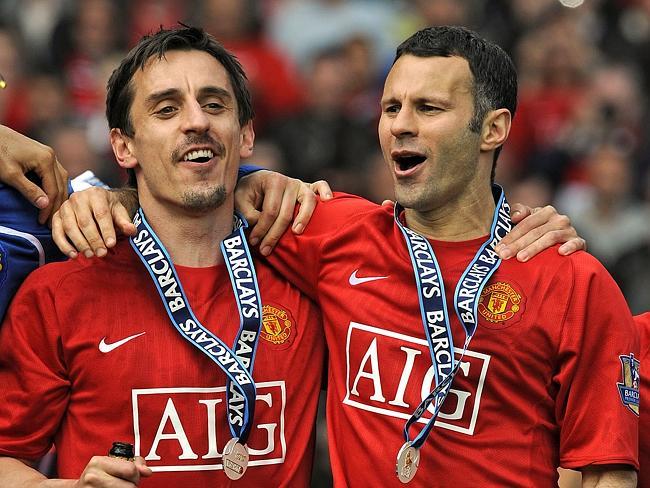 Gary Neville (L) and Welsh midfielder Ryan Giggs celebrate after they helped Manchester United clinch the EPL title in 2009.