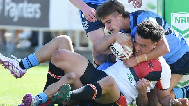 Chevy Stewart holds back CIS’ Lennox Risati from the line. Pic: Patrick Woods.