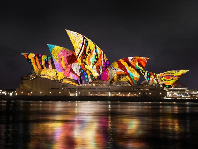 The sails of the Sydney Opera House lit up with iconic Martu painting celebrating our indigenous heritage.