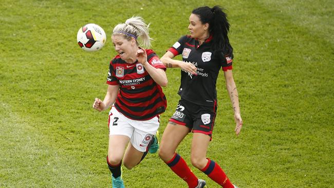 Wanderers star Caitlin Cooper fights for the ball against Adelaide Adriana Jones.