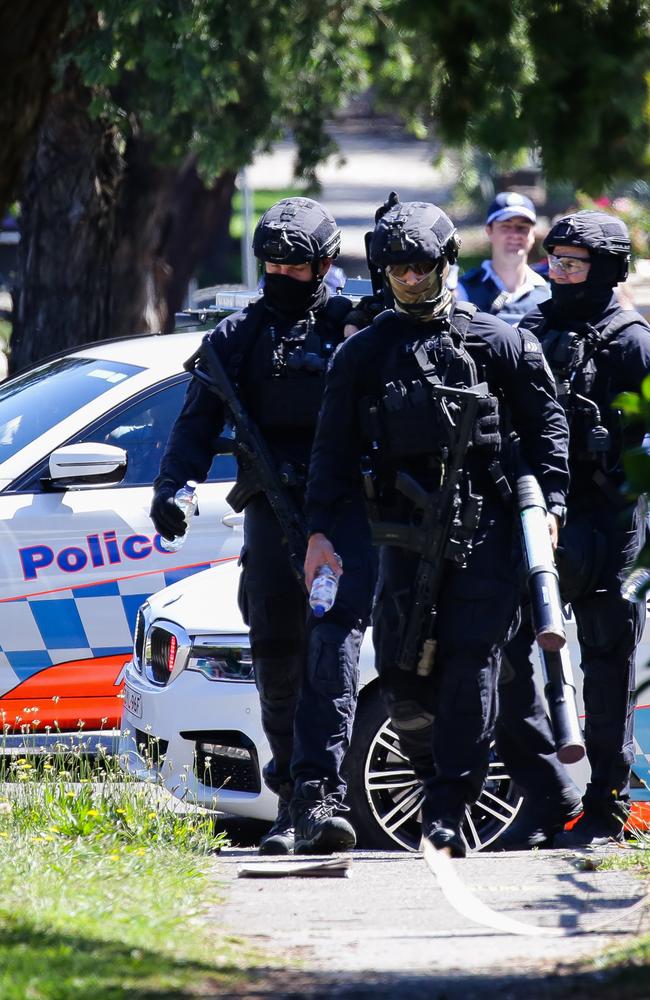 Tactical police scour the street. Picture: NCA NewsWire / Gaye Gerard