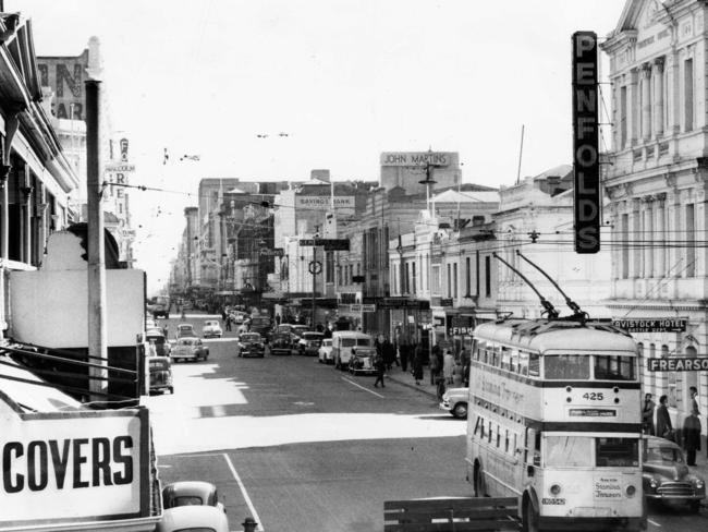 A bus heads down Rundle St, 1955.