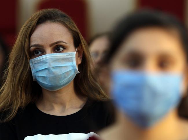 Christian worshippers attend a mass while wearing protective masks due to the COVID-19 pandemic at the Mart Shmoni church in Arbil, the capital of the autonomous Kurdish region of northern Iraq, on May 17, 2020. (Photo by SAFIN HAMED / AFP)