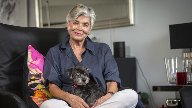 Mary-Rose Aitkin, 70, with her treasured dog Coco in her Adelaide CBD apartment. Picture: Emma Brasier