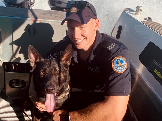 Senior Constable Harry Vincent with Patrol Dog Quake, who died this week after a short illness. Picture: NTPFES