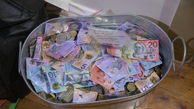 Money seized as part of the operation led by the AFP. Picture: AFP