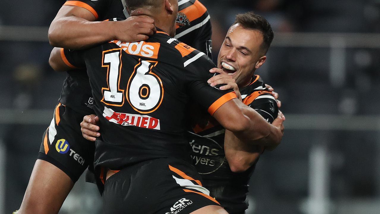 Tigers halfback Luke Brooks celebrates.