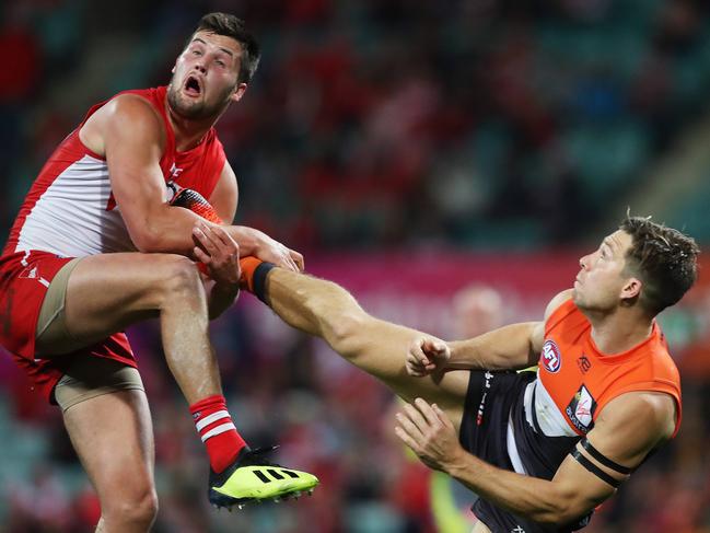 Giants Toby Greene kicks Sydney's Nic Newman to mark a ball during AFL Elimination Final between the Sydney Swans and GWS Giants at the SCG. Picture. Phil Hillyard