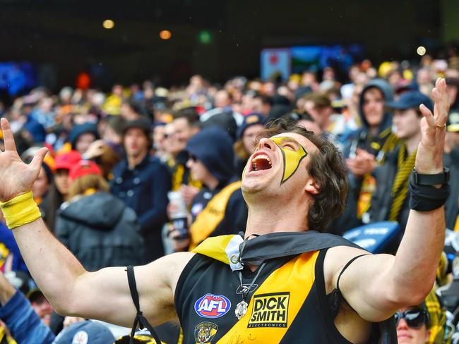 A fan roars. Picture: Jason Edwards