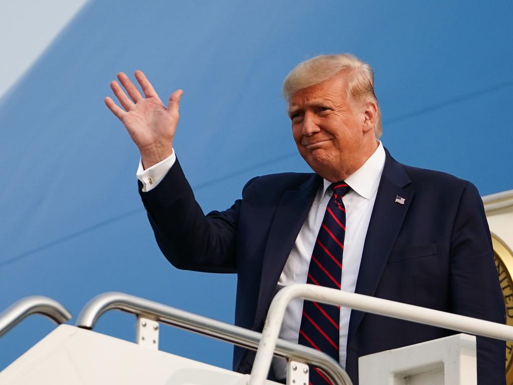 US President Donald Trump waves as he steps off Air Force One yesterday. Picture: Mandel Ngan/AFP