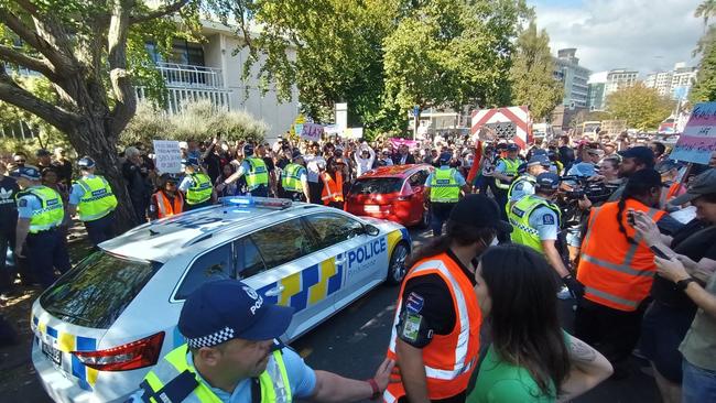 Police hold back protesters at the Auckland rally. Picture: Dylan Reeve