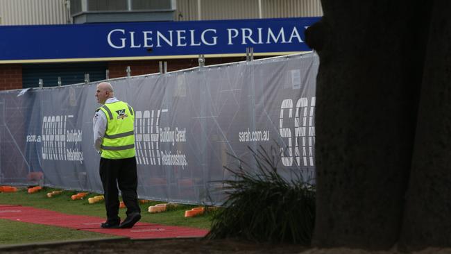 A security officer at Glenelg Primary School after police began investigating an abduction attempt of a year four girl. Picture Emma Brasier