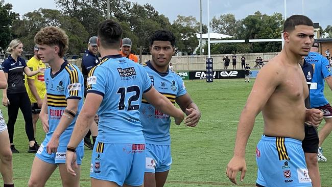 Norths under-18 captain Lauloto Salei, facing a teammate when he shakes his hand.