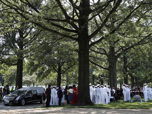 Family and friends attend a burial service at Arlington National Cemetery in Arlington, Virginia, for one of the sailor who died when the USS Fitzgerald collided with a container ship. Picture: AP