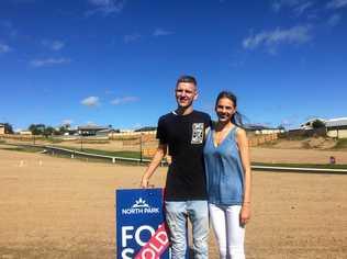 EXCITING TIMES: Bryce Roy and Rhiannon Tedge out the front of their new North Park Estate property, expected to be built by Christmas. Picture: Josh Preston