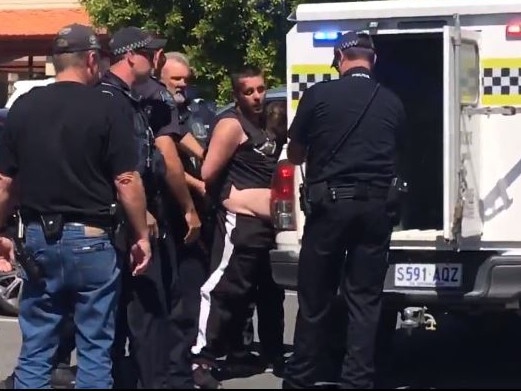 MUST CREDIT  . Parolee Luke Brandon is arrested at Goolwa shopping centre  today after a manhunt . Picture: Nine News