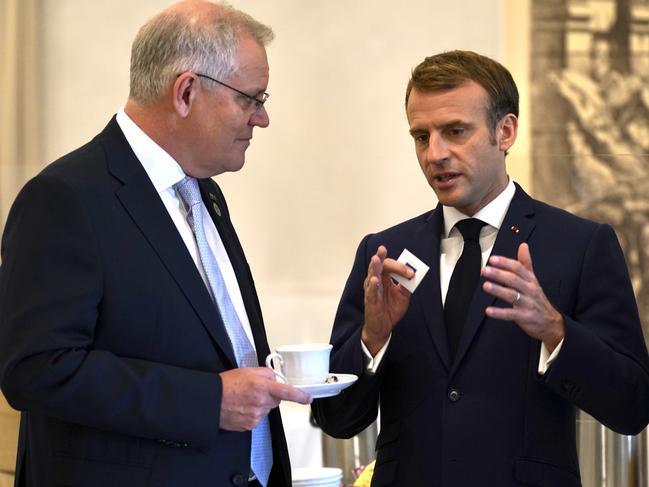 Calm before the storm: Scott Morrison and Emmanuel Macron talk at the G20 in Rome. Picture: Adam Taylor