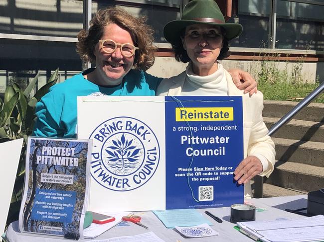 The "Bring Back Pittwater Council" lobby group was collecting signatures for a petition to "demerge" the former Pittwater Council from Northern Beaches Council. Katie McLeish (left) and Anna Maria Monticelli were grabbing names outside the Mona Vale Memorial Hall polling booth on Saturday. Picture: Jim O’Rourke