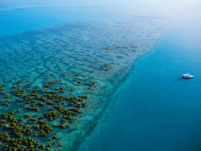 EMBARGO FOR TRAVEL + LUXURY MAGAZINE 16 DECEMBER 2022. Torres Strait Islands, Australia. The Home Strait. PHOTOGRAPHY BY Jonathan Cami. WORDS BY Kendall Hill. Ask permission to reuse images. Holmes Reef, next to Ngurapai (Horn Island) in the Torres Strait Islands archipelago.