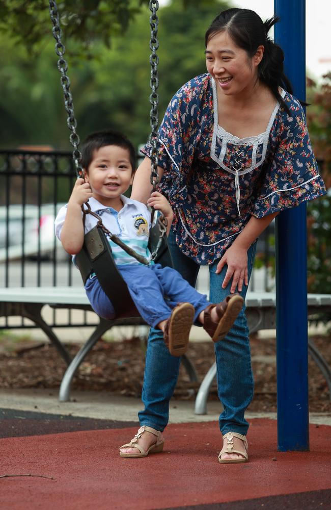 Lei Wang with two-year-old son Oscar in Eastwood on Tuesday. Picture: Justin Lloyd