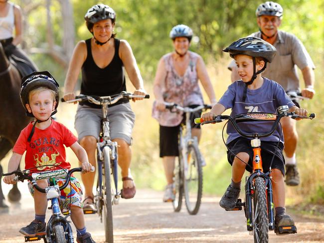 The Spence's, Owen, 4, Simone and Ethan, 6, lead Lauren Howes, 22, on Remi, and Diane and Mal Poulton on the Lilydale to Warburton Rail Trail, one of Victoria's many disused rail trails that have been turned into bicycle, walking and horse-riding paths.