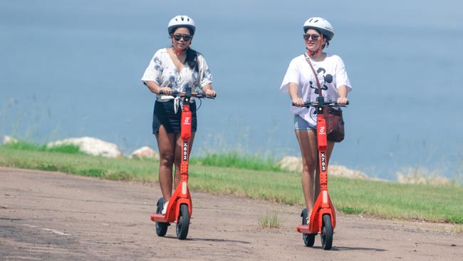 More Darwinites are using e-scooters as a result of increasing fuel prices Nicola Wickramaratne (R) and Mei Li Chang are locals who have turned to e-scooters. Picture: Glenn Campbell