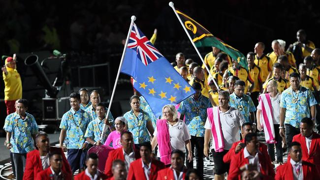 Commonwealth Games Gold Coast 2018 Opening Ceremony Teams March. Teams are in order of entering the stadium, with the host country Australia being last. 04 Apr 2018 Pictured: Teams / Flags are in order of Entering the Stadium and Australia Being last as the host Country. Photo credit: A Carlile / MEGA TheMegaAgency.com +1 888 505 6342