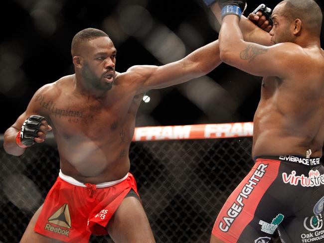 Jon Jones punches Daniel Cormier in his last defence of the light-heavyweight belt - possibly ever.