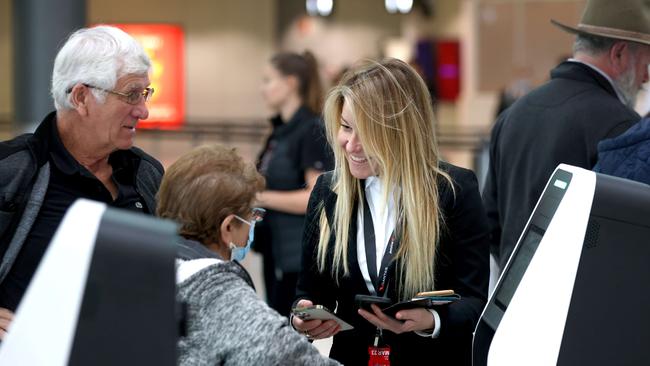 Qantas executives like Olivia Wirth have been helping out at airports as the airline tries to address operational issues. Picture: NCA NewsWire/Damian Shaw