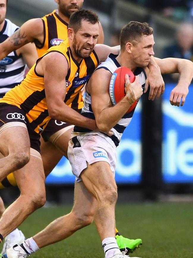 Luke Hodge takes Joel Selwood high in the final term. Picture: Getty Images