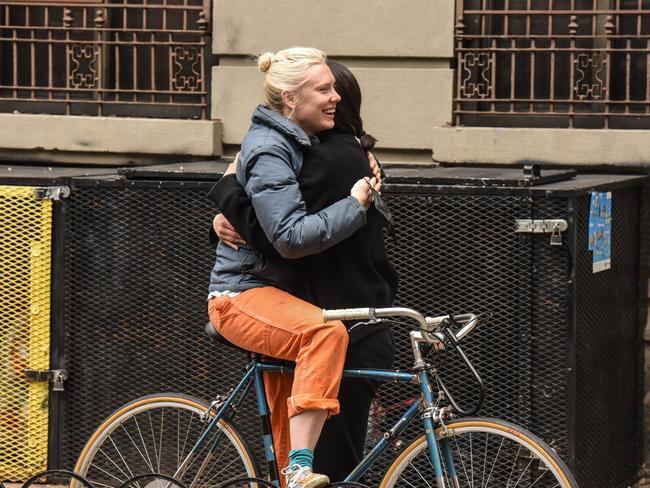 Two New Yorkers embrace on the street. Most New Yorkers have been staying home but may soon be able to move more freely outside. Picture: Getty Images/AFP