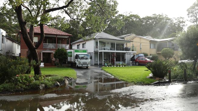 Flooding at Carina Rd in Picnic Point. Picture: John Grainger