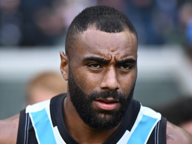 MELBOURNE, AUSTRALIA - APRIL 20:  Esava Ratugolea of the Power runs out onto the field during the round six AFL match between Collingwood Magpies and Port Adelaide Power at Melbourne Cricket Ground, on April 20, 2024, in Melbourne, Australia. (Photo by Quinn Rooney/Getty Images)