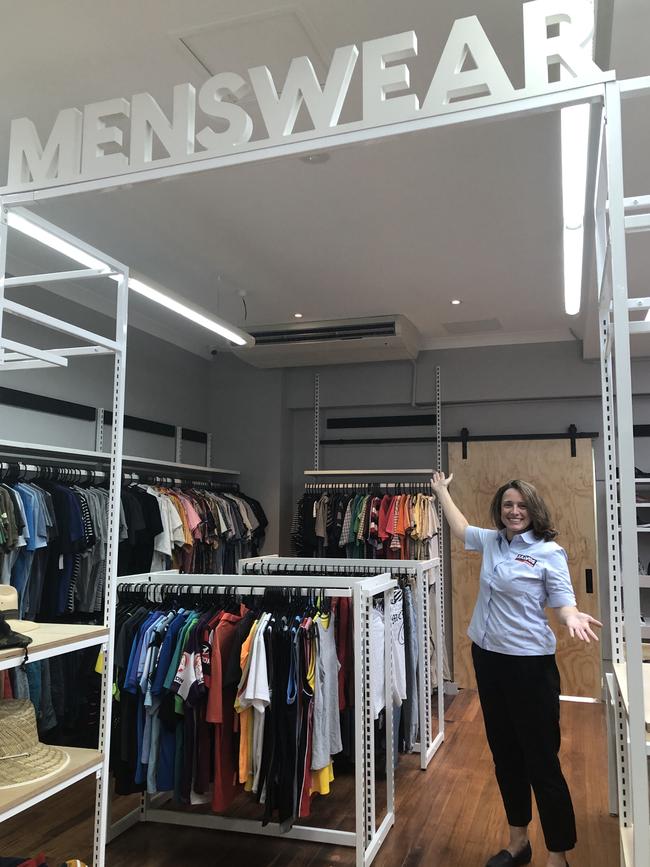 Store assistant Caroline Bell shows off the menswear section