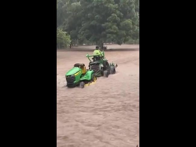 220525_Man rescuing his one true love from raging floods