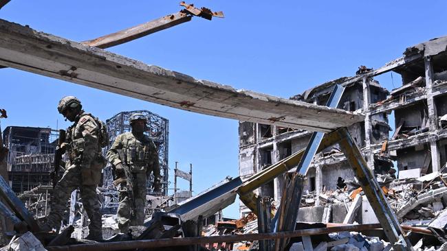 Russian troops patrol the Azovstal steel plant in Mariupol in June 2022. Picture: AFP