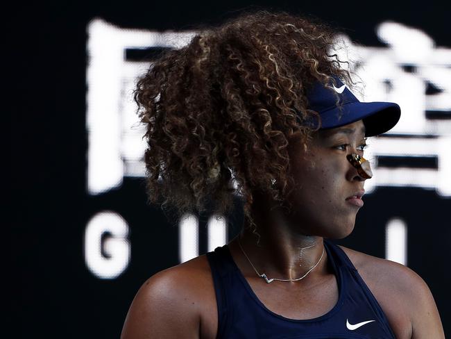 Naomi Osaka looks on as a butterfly lands on her face in her Women's Singles third round match against Ons Jabeur on day five of the 2021 Australian Open. Picture: Daniel Pockett