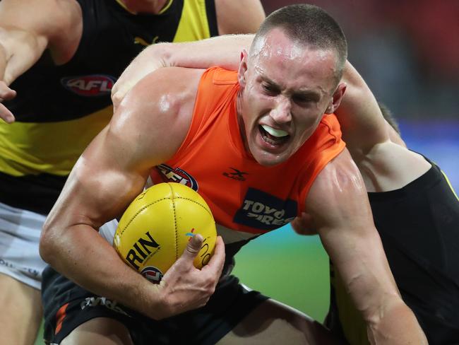 Giants Tom Scully tackled by RichmondÕs Jack Riewoldt during AFL match GWS Giants V Richmond Tigers at Spotless Stadium, Sydney. Picture. Phil Hillyard