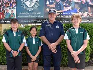 LOCAL COP: Dalby South State School's adopted police officer Sgt Brett Hunter with Tai Phipps, Monika Stritzel and Joseph Routley.