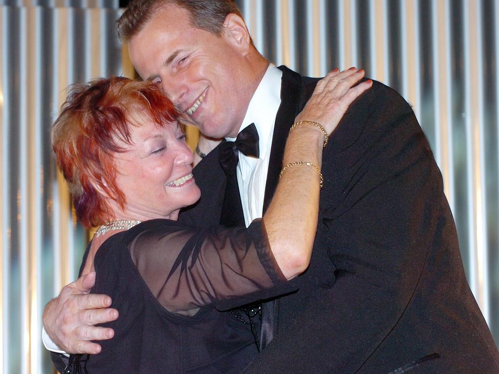 Sylvia Wolf receives a hug from then Tourism Minister Paul Henderson after winning the Tourism Ministers's Perpetual Trophy at the 21st NT Brolga Awards.