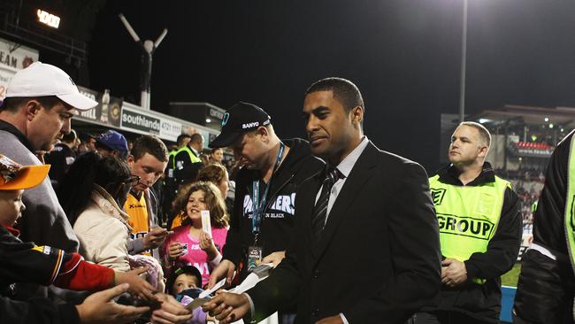 Michael Jennings hands out tickets after being stood down by Penrith in 2011.