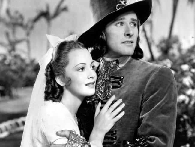 Olivia de Havilland and Errol Flynn in 1935 film 'Captain Blood', one of their many pairings in romantic swashbucklers.