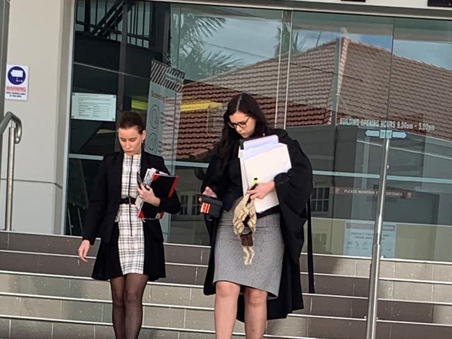 Crown prosecutor Tiffany Lawrence (right) leaves court with a Director of Public Prosecutions employee.