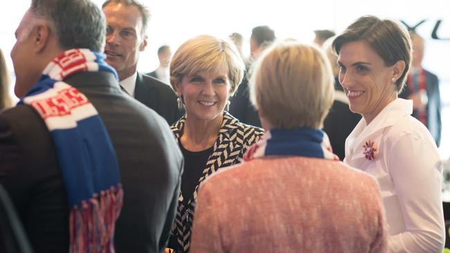 Julie Bishop with partner David Panton and Australia Post CEO Ahmed Fahour (far left) in the Olympic room of the MCG. Pic: AFL Media